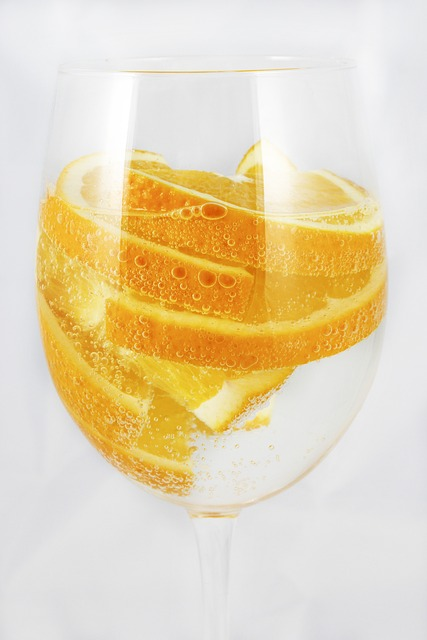 oranges, sparkling water, a glass of