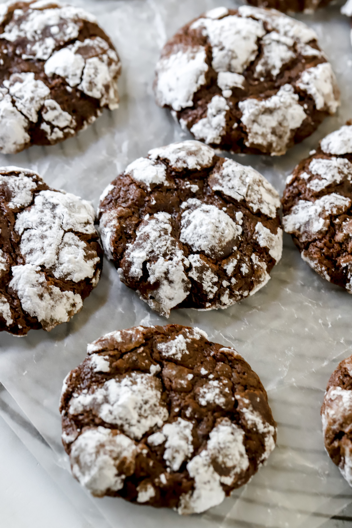 double chocolate crinkle cookies on parchment paper