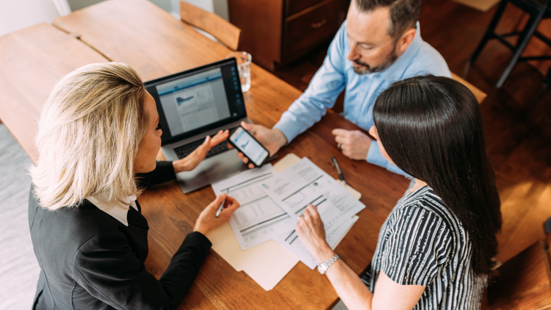A financial planner helping a couple to create a financial plan that includes retirement accounts for long-term tax efficiency and strategies to increase tax savings