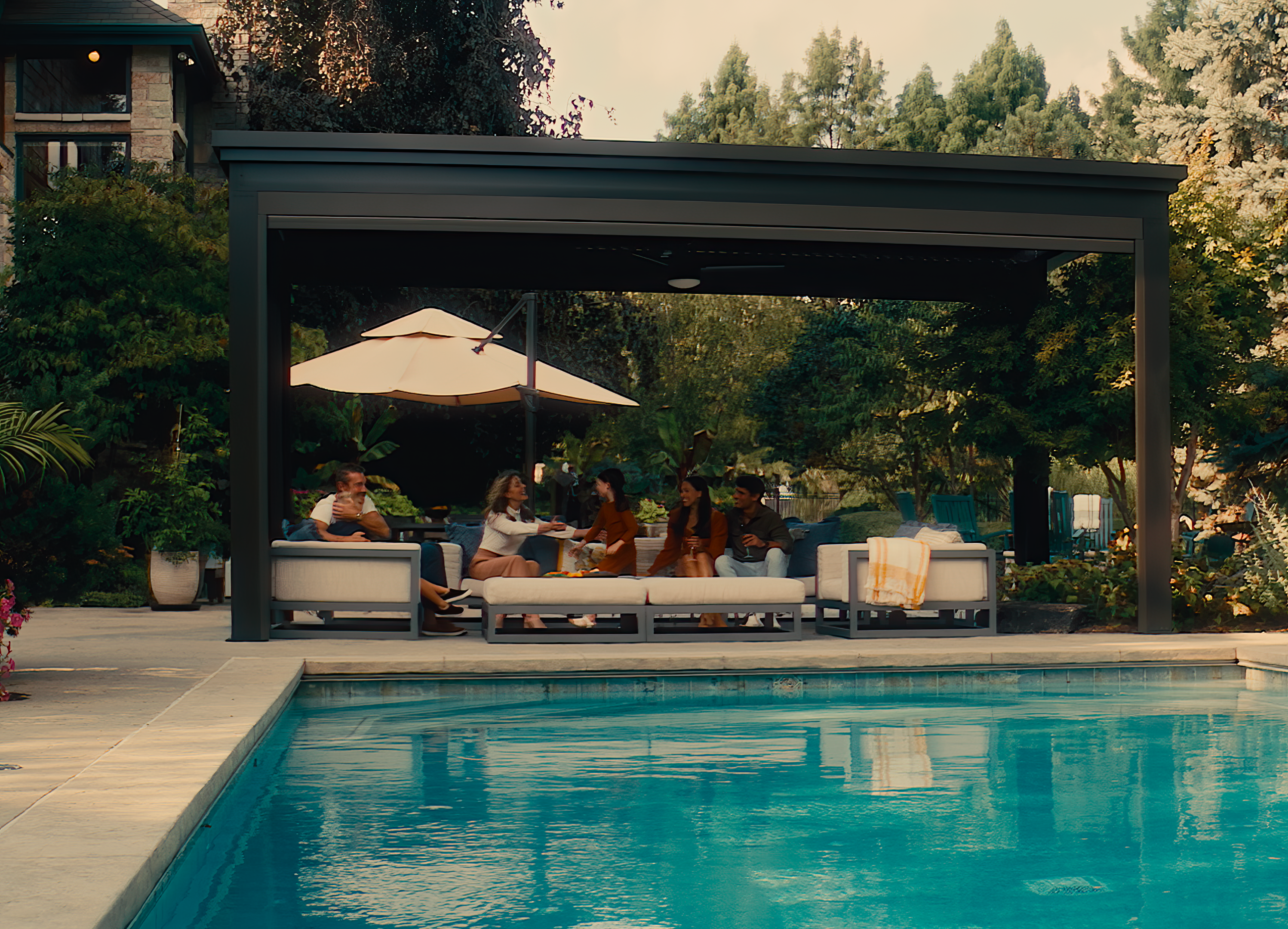 A poolside pergola can provide a calming place to reflect after a full day.