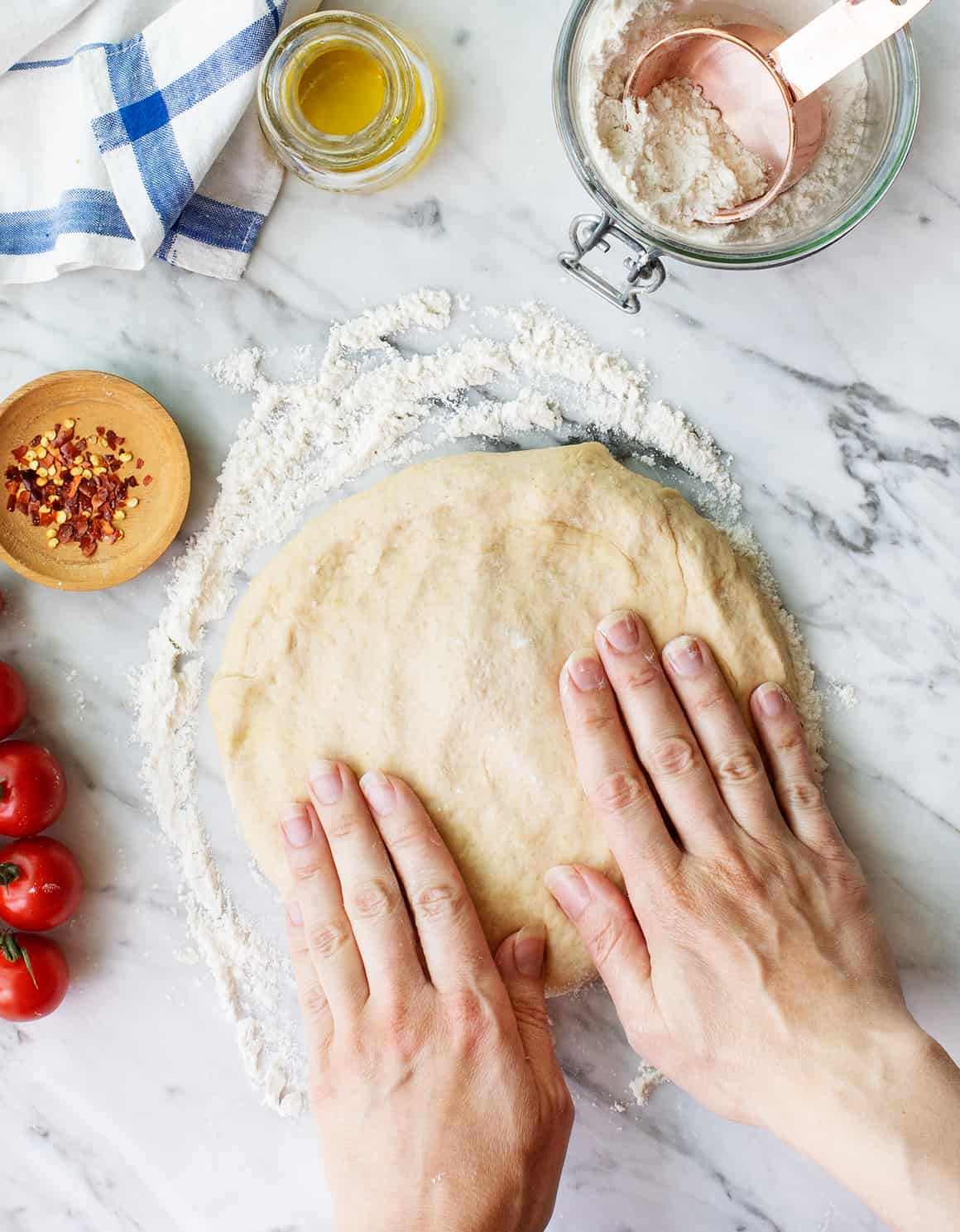 Shaping the pizza dough