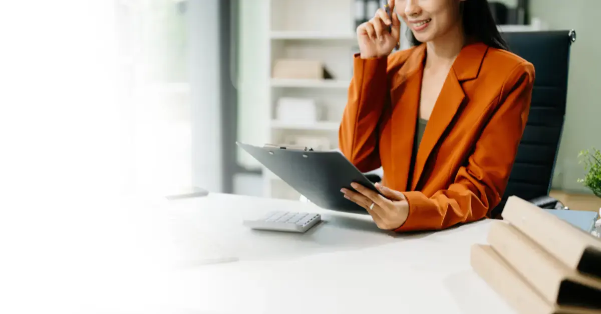 Woman reviewing K1 distribution tax forms for OnlyFans creator business income and tax obligations.