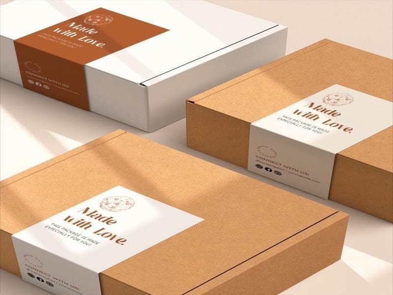 A picture of brown and white subscription boxes with simple labels that say “Made with love,” placed neatly on a surface.