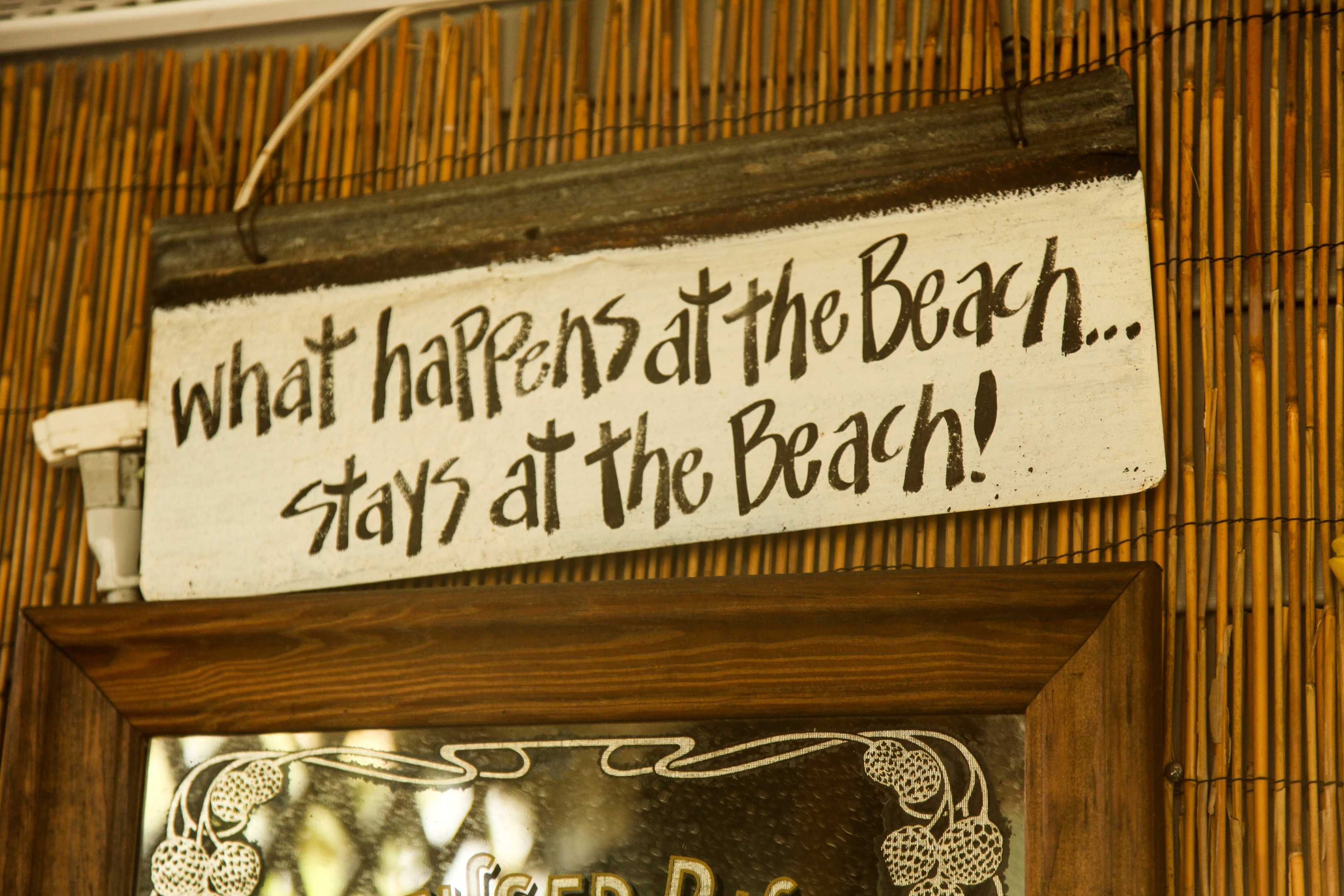 Things to Do on Pine Island, sign that we found there that reads "what happens at the beach, stays at the beach."