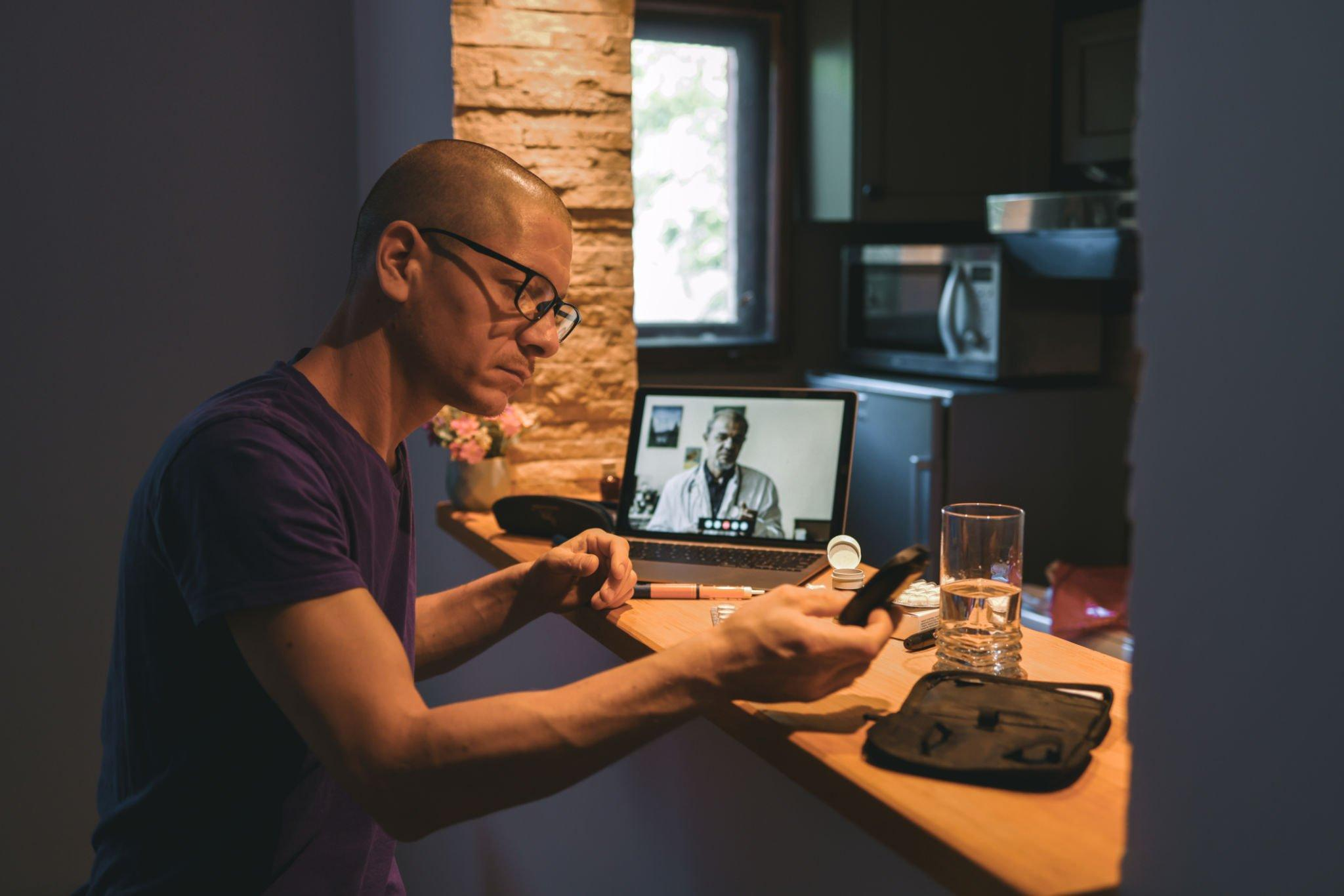 A man having an online consultation, discussing risk factors of diabetes, reviewing test results, and evaluating the potential to develop diabetes.