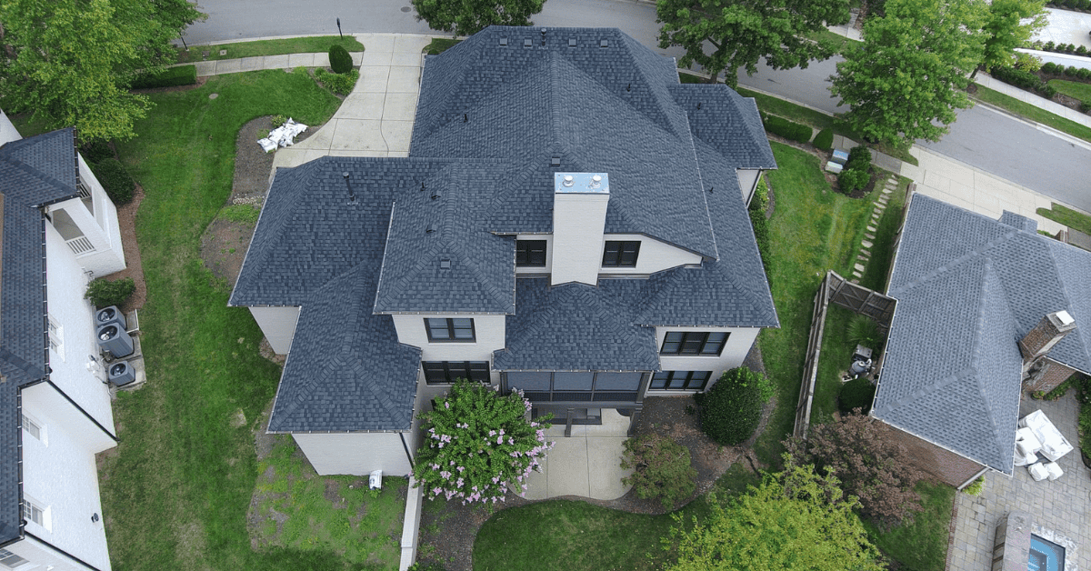 Aerial view of a large home in Franklin, TN with a newly installed architectural shingle roofing system.