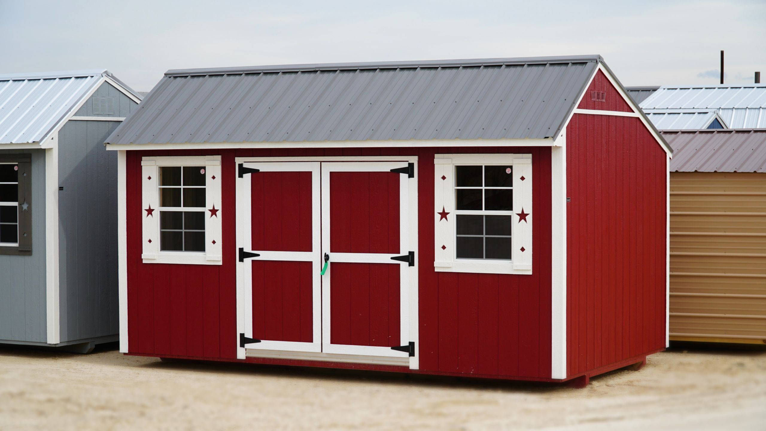red garden shed with grey metal roof
