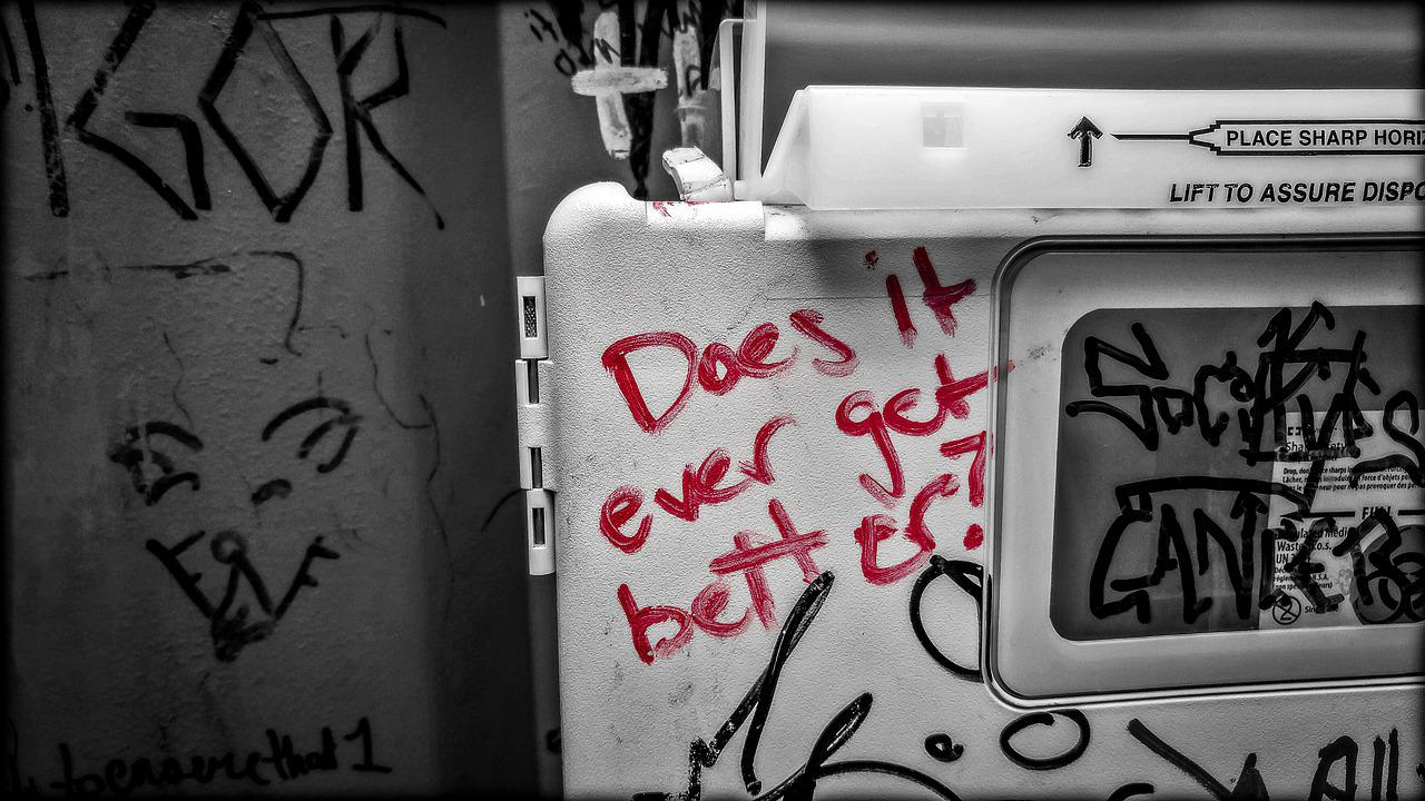 the words "does it ever get better" written on a needle collector, rehab center in los angeles