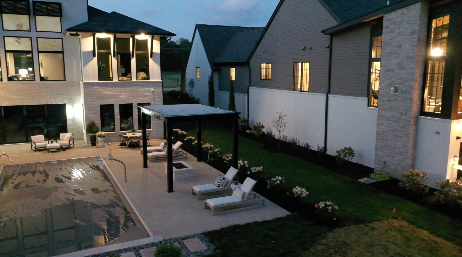 installation of black louvered roof pergola