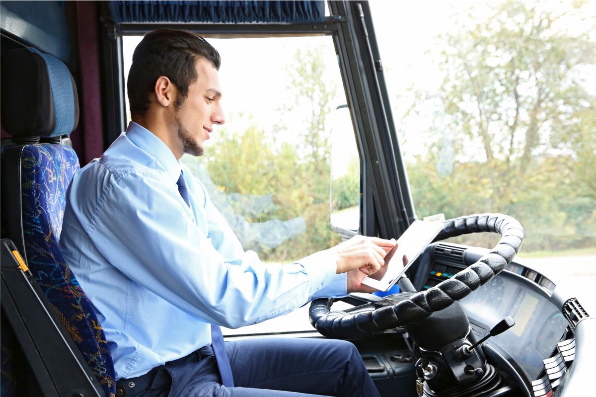bus paratransit driver looking at a fixed route schedule