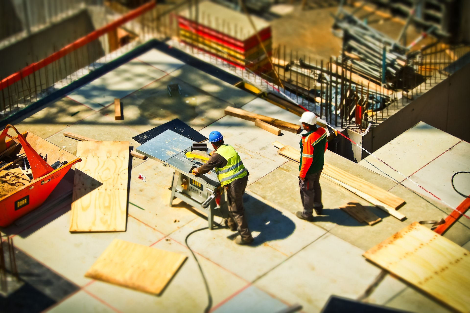 An image showing a construction worker with a hard hat and safety vest, representing the required experience and qualifications for jobs in UK construction.