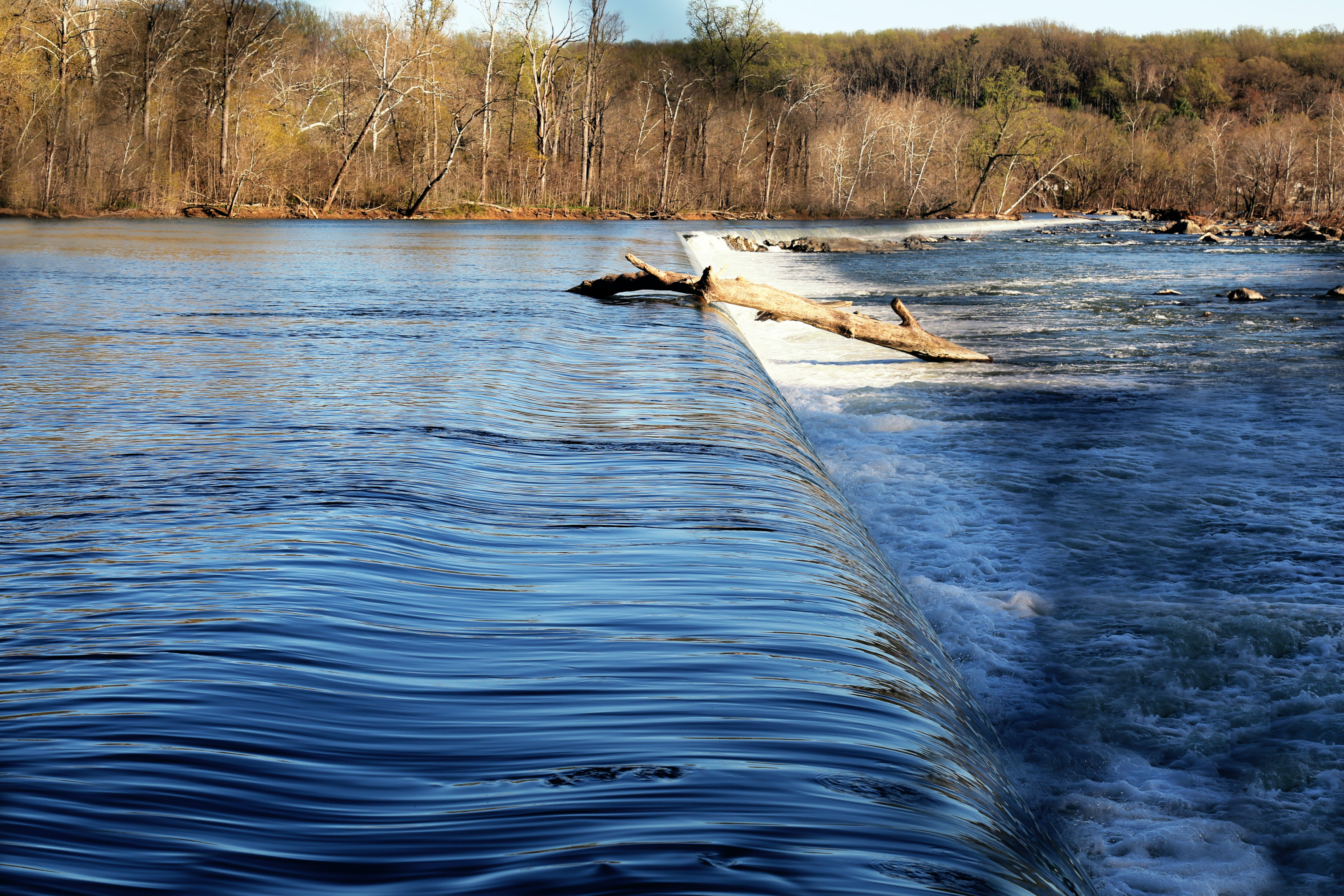 brown wooden log of river aqueduct 