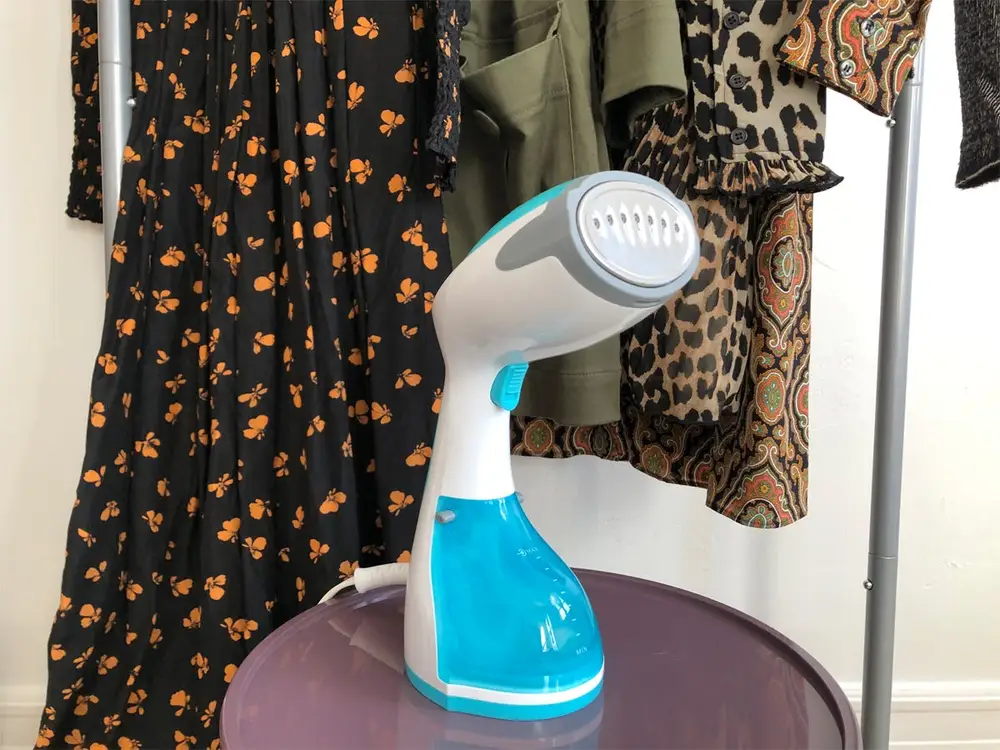 Run the garment steamer filled with tap water and distilled water