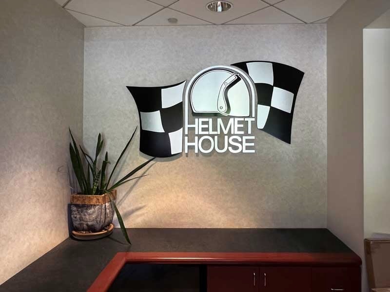 Helmet House – A bold and polished lobby sign that gives the space a professional, welcoming touch.