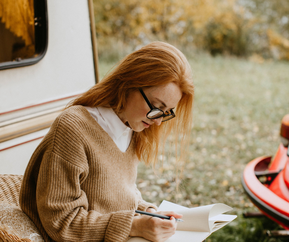 woman reviewing a contract outdoors before publishing her trade paperback