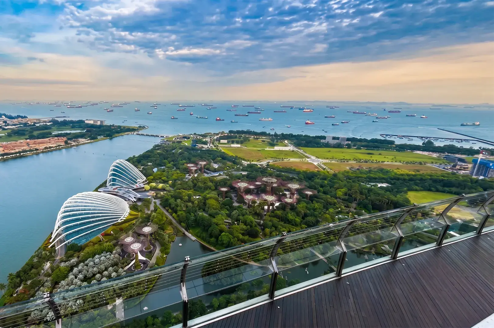 Aerial view of Gardens by the Bay with the iconic Supertree Grove and cooled conservatories in Singapore.