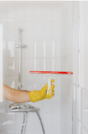 wiping shower glass clean 