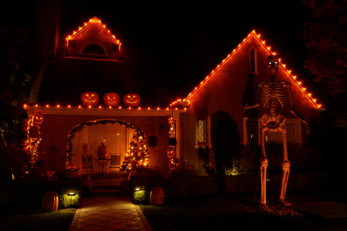 A creative DIY Halloween lighting setup using painted pumpkins.