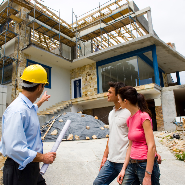 Image showing a roofing contractor consulting with homeowners about a new room. 