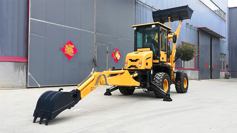 Everstar Backhoe Loader in front of a Factory