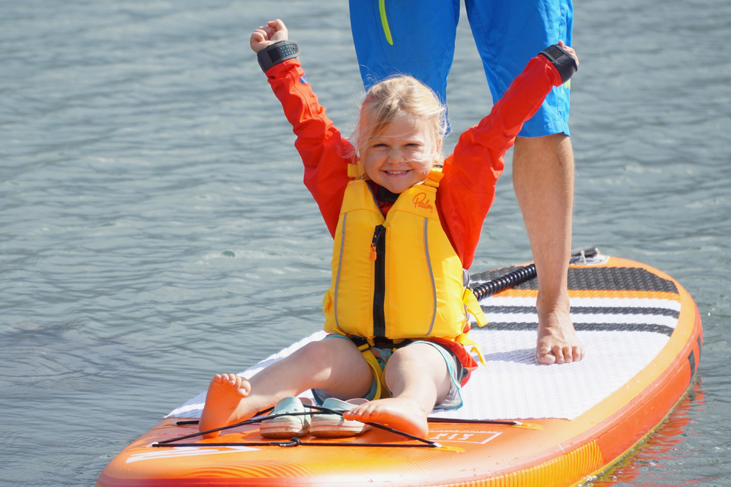 A child wearing a personal flotation device