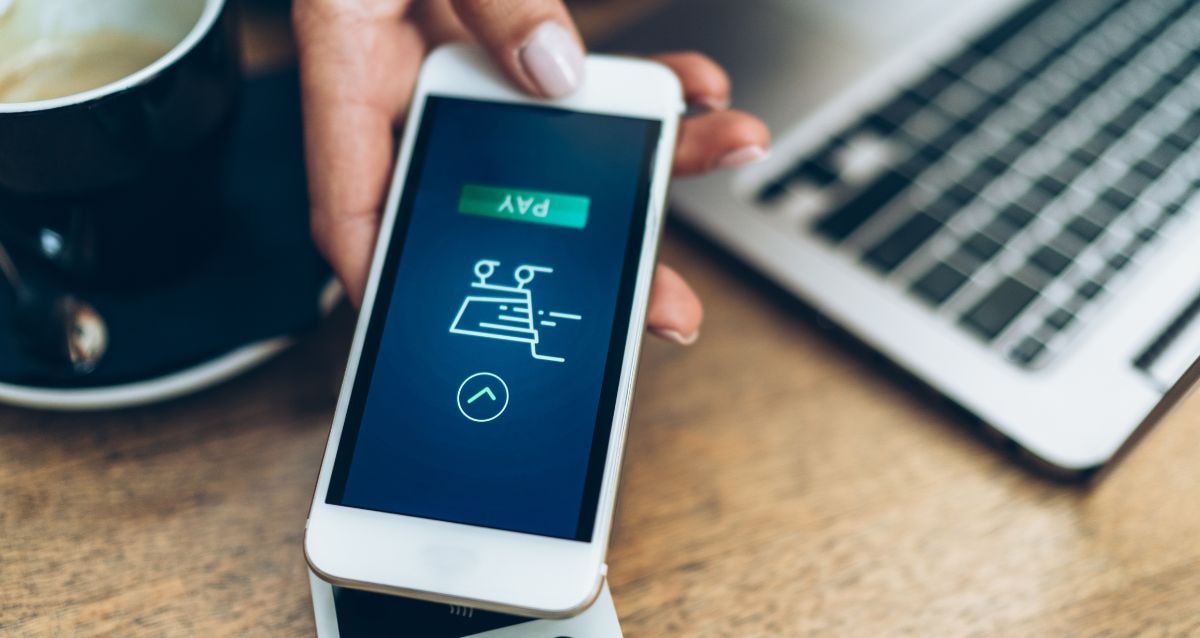 Business owner uses Zelle's platform to make a payment on their phone
