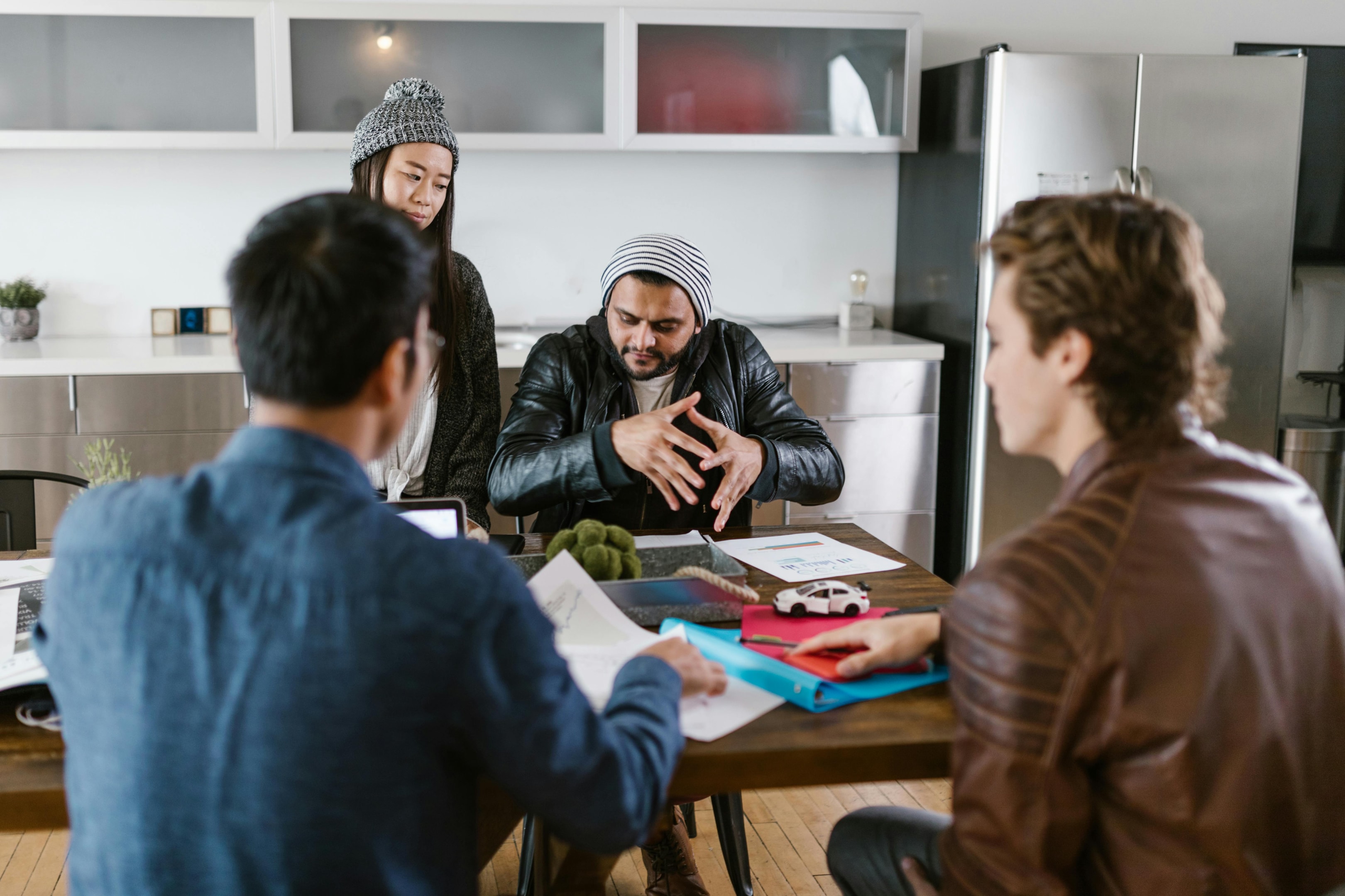 Real estate investment team meets with sellers of distressed property to discuss their options for selling.