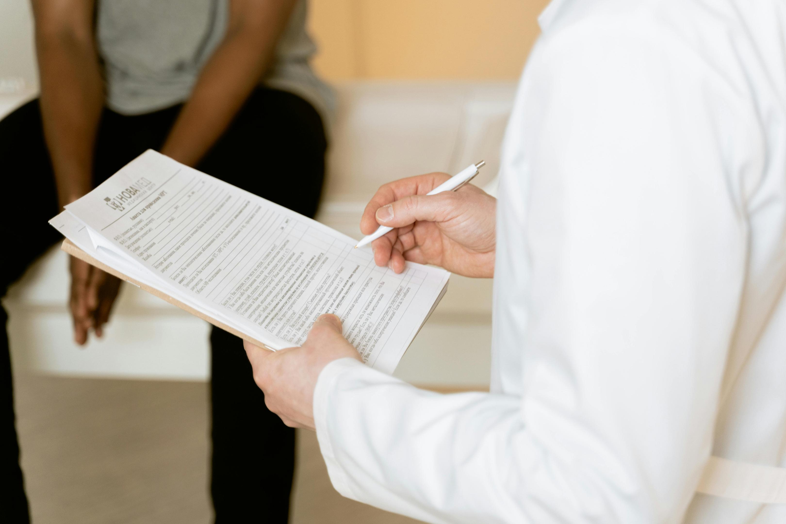 An addiction specialist consults with a client, reviewing the detox symptoms timeline