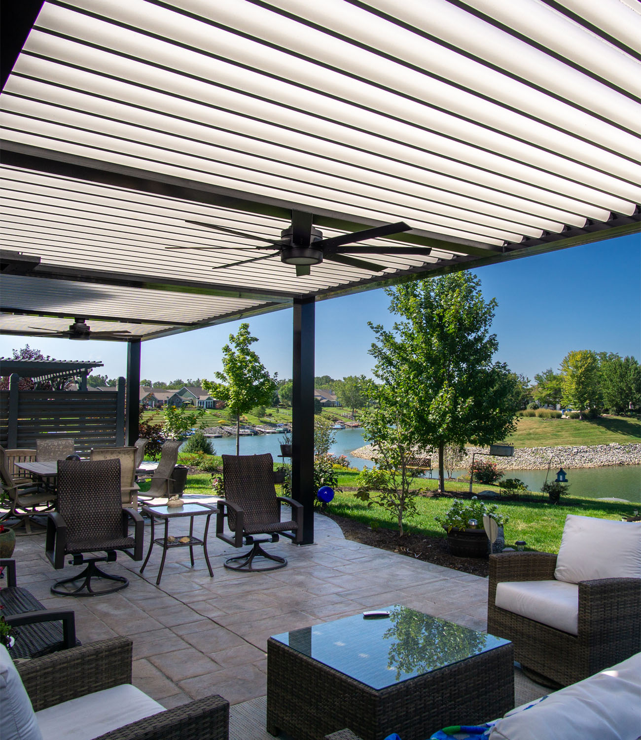 Customized motorized aluminum pergola which features ceiling fan