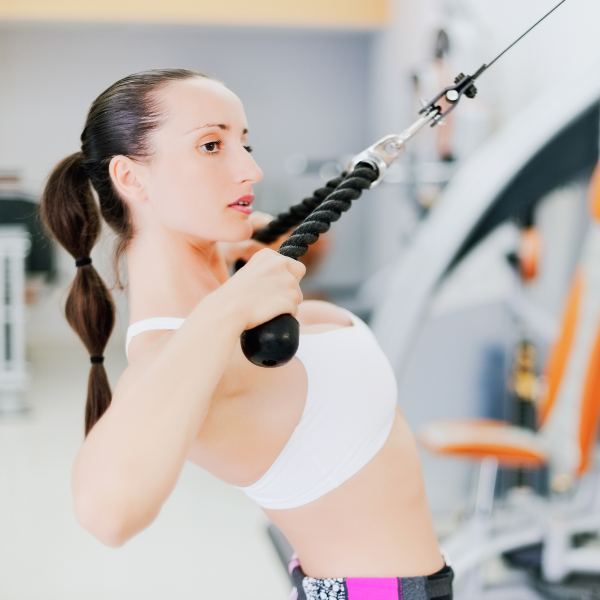 Image showing a person doing face pulls using a cable machine.