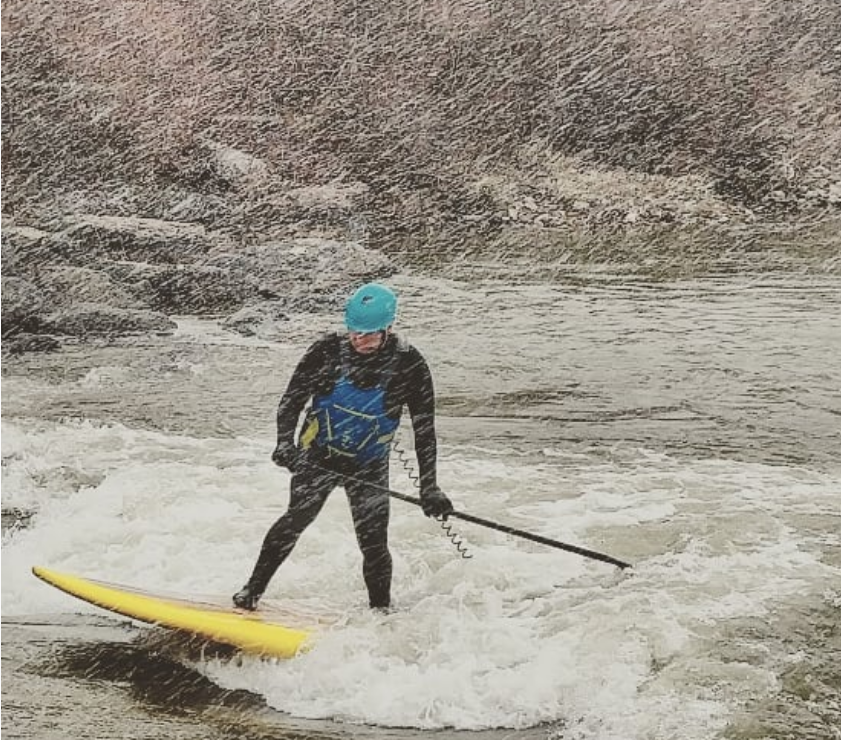 river surfing on a glide paddle board