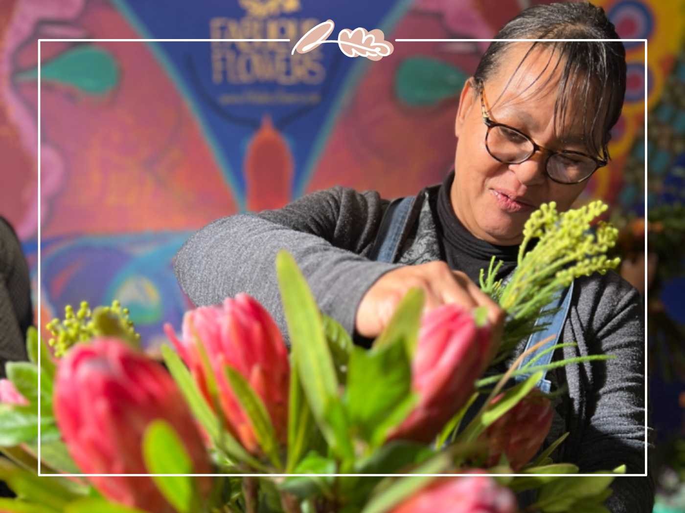 Florist carefully arranging pink flowers by Fabulous Flowers and Gifts