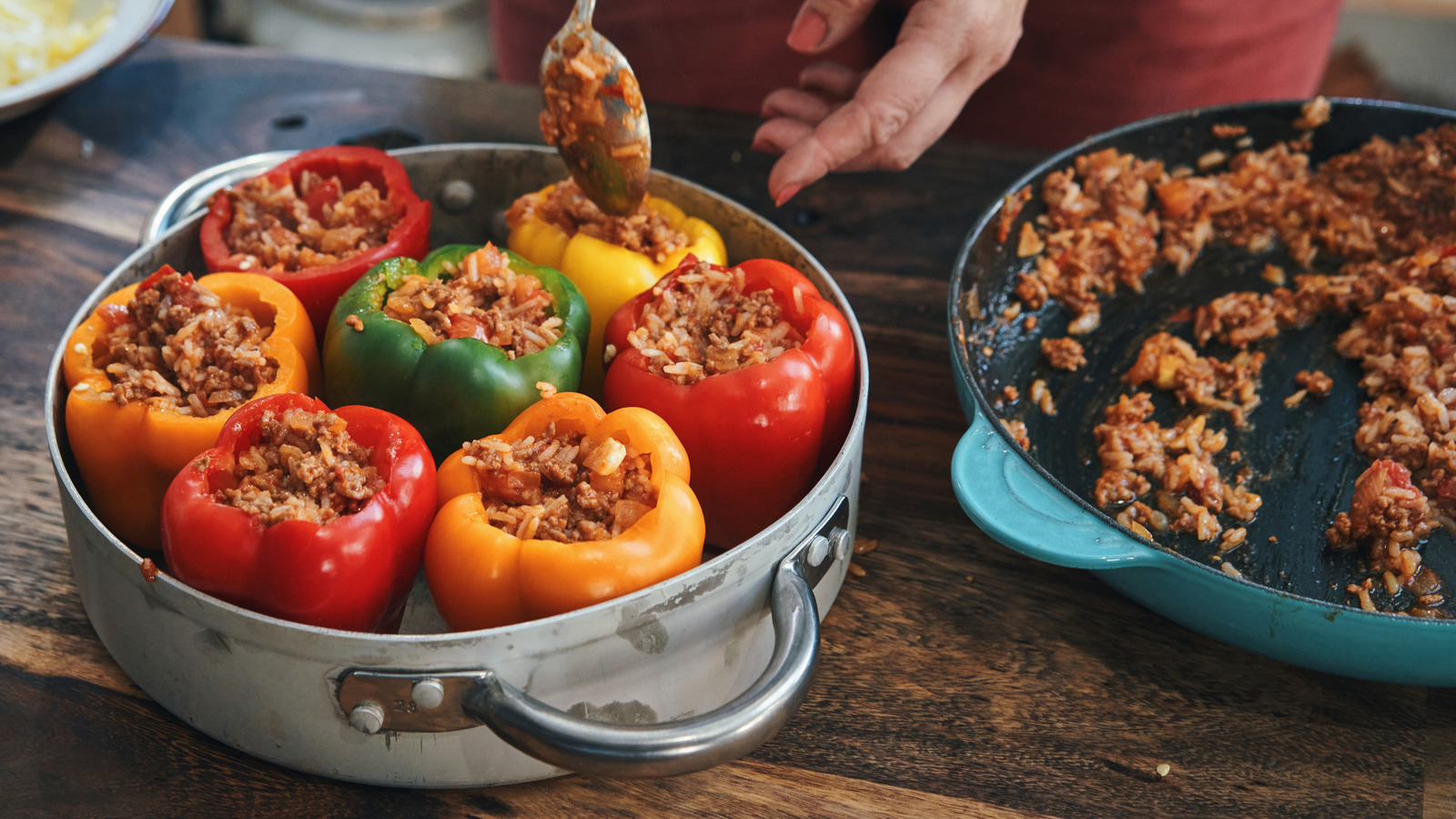 A group of bell peppers stuffed with ground beef and rice