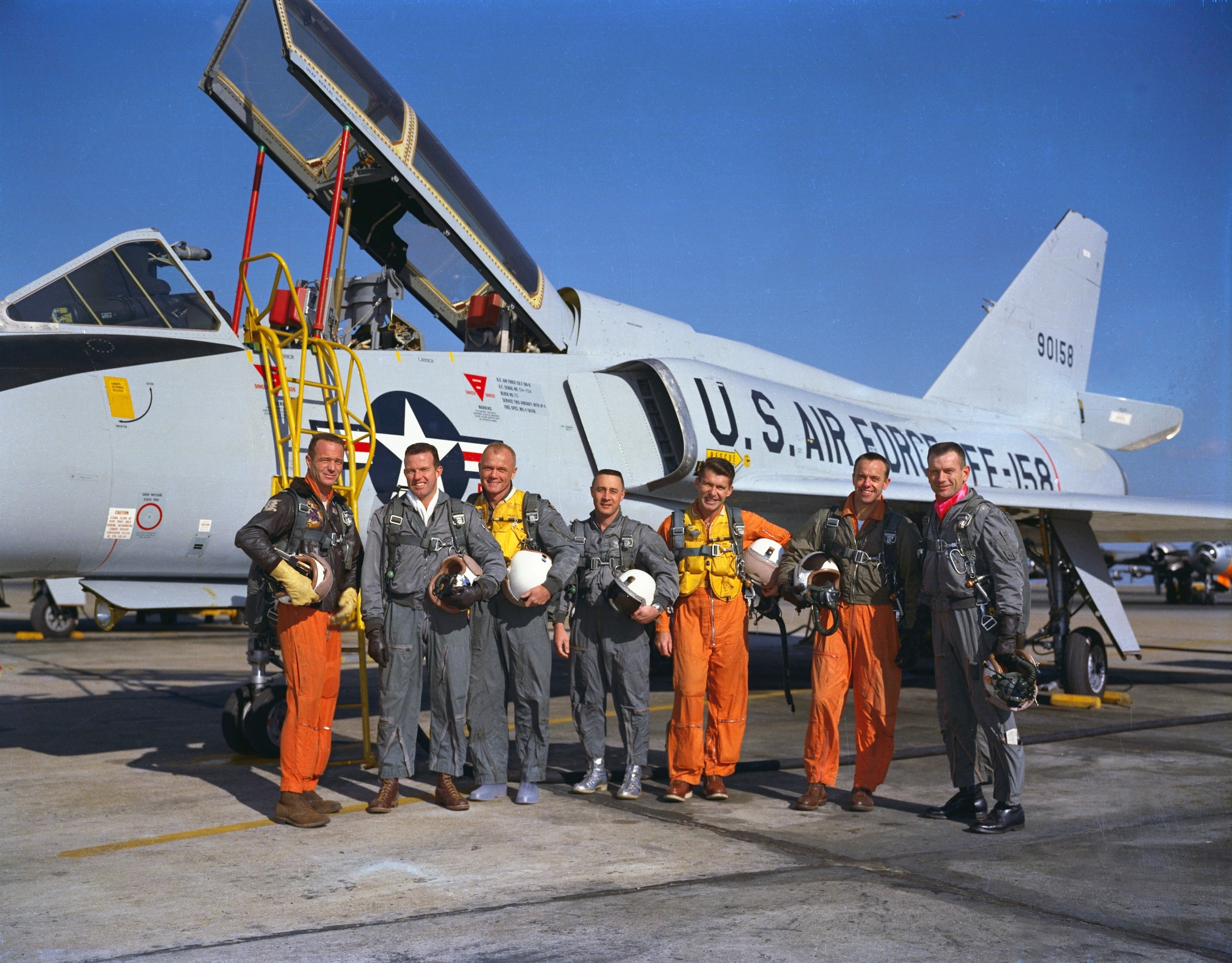 The Mercury Seven in front of an F-106 Delta Dart, used in aviation movies.