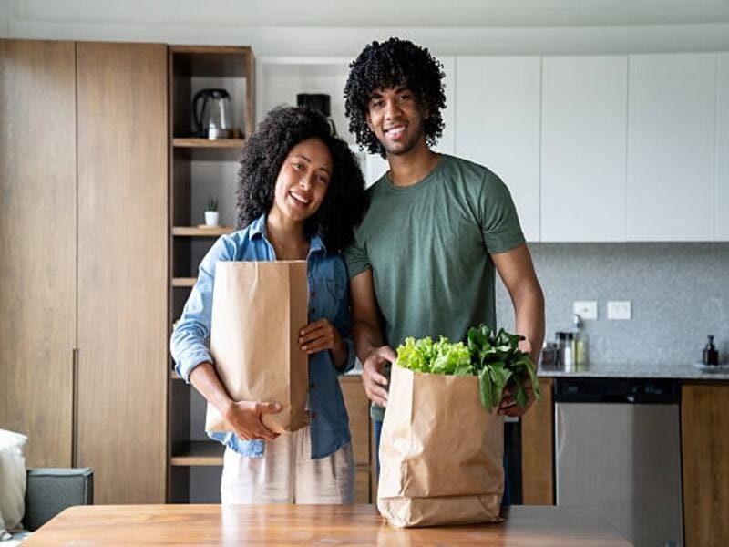 Eco-friendly paper bags holding various products. Paper bags are sturdy enough to hold the load of groceries and vegetables. They are a sustainable alternative to plastic bags. They keep your eatables fresh while supporting a green lifestyle. It's a perfect solution for your everyday shopping needs.