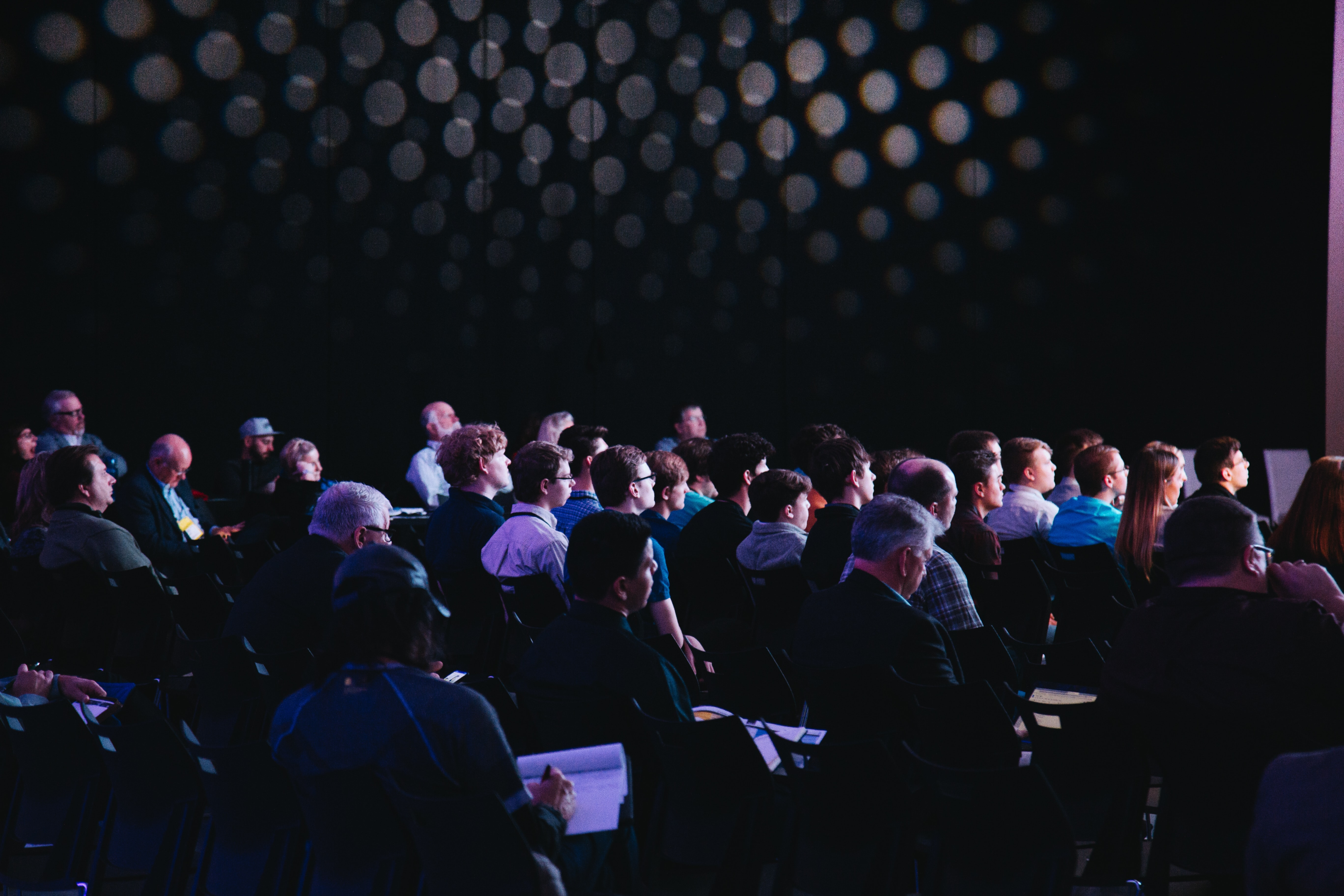 Face to Face Events Back on Track | Photo of a conference audience sitting. | Image link: https://images.unsplash.com/photo-1540575467063-178a50c2df87?ixlib=rb-1.2.1&ixid=MnwxMjA3fDB8MHxwaG90by1wYWdlfHx8fGVufDB8fHx8&auto=format&fit=crop&w=1170&q=80