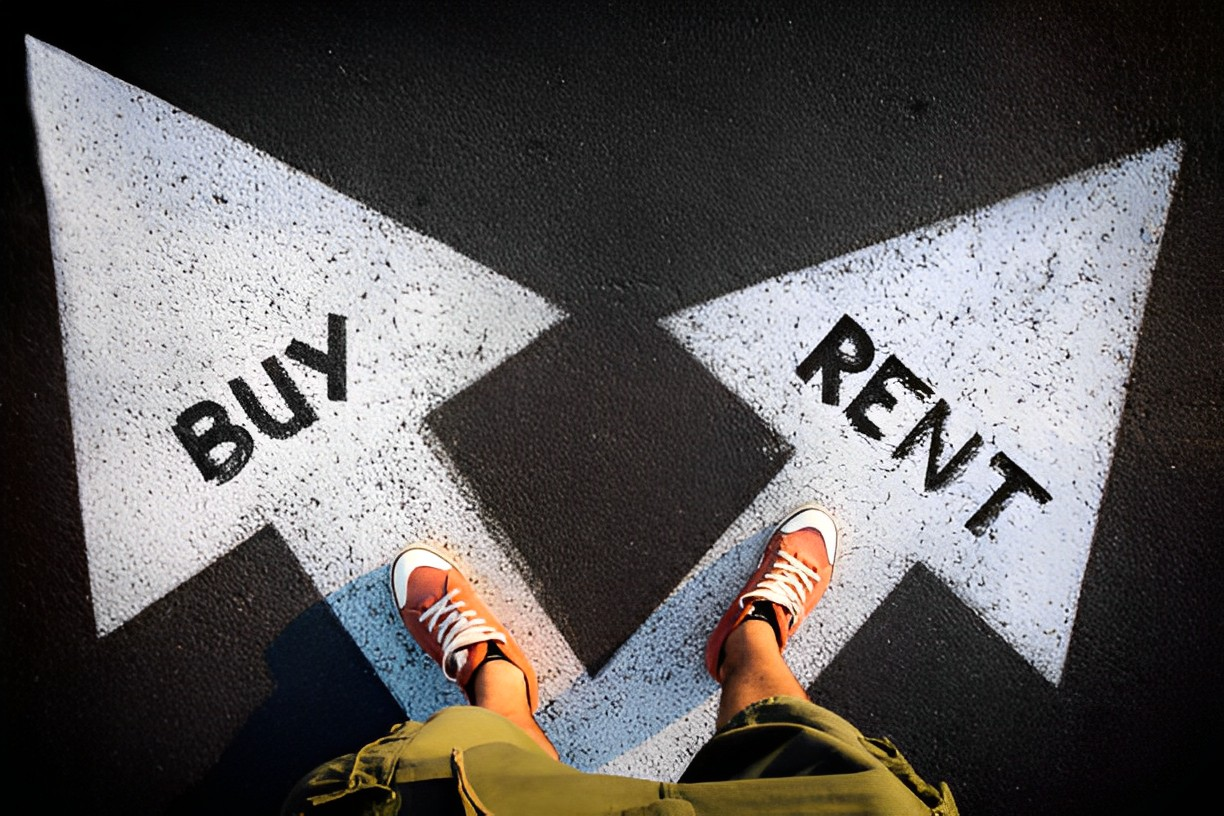 A photo of the feet of a man stepping into the buy and rent arrow signs