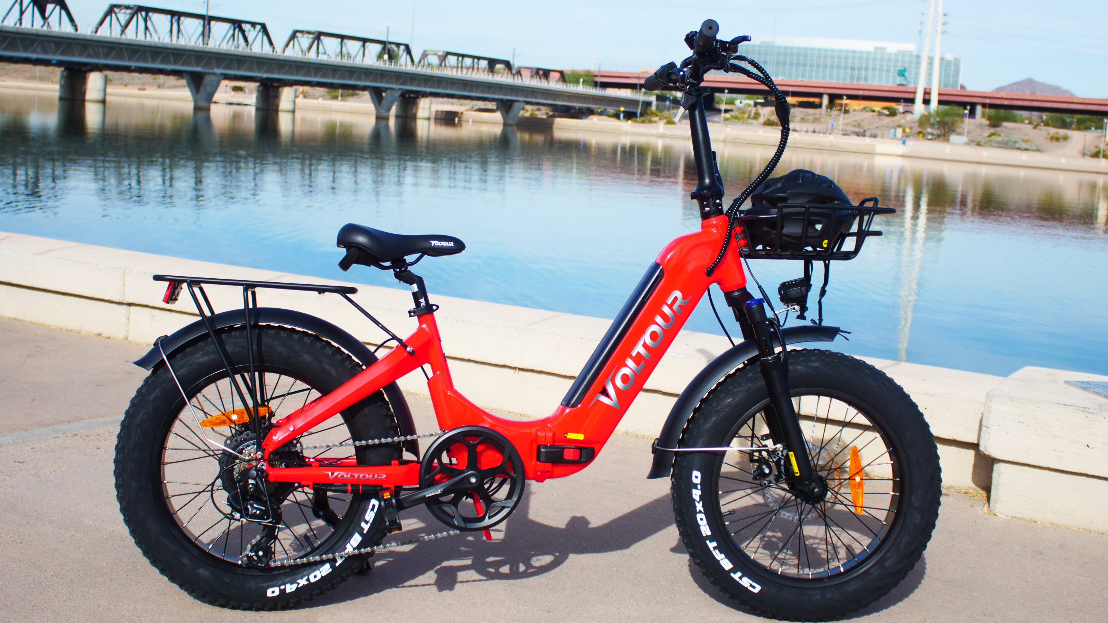 ebike in front of bridge and water