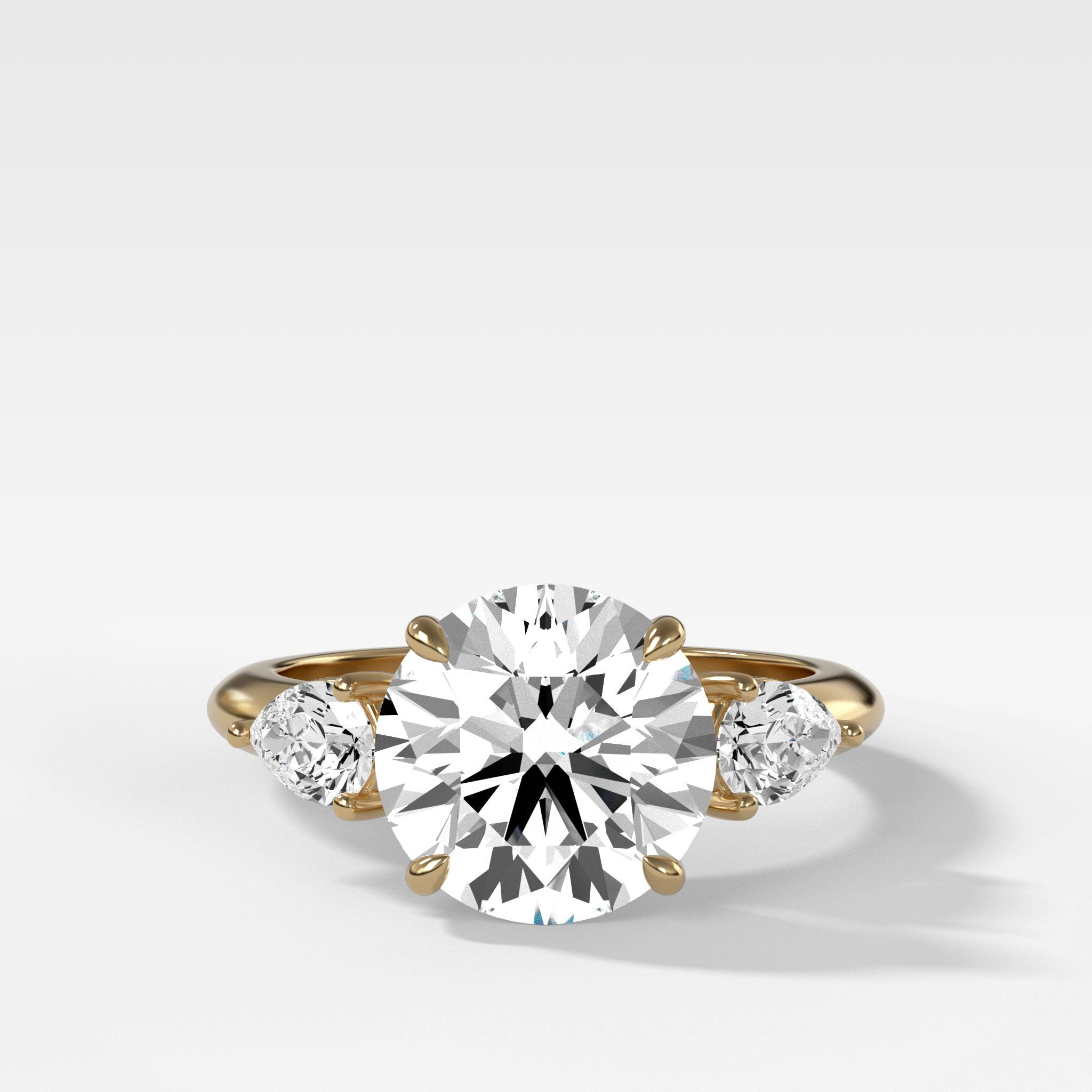 GOODSTONE Three Stone Engagement Ring With Pear Side Stones With Round Cut Diamond