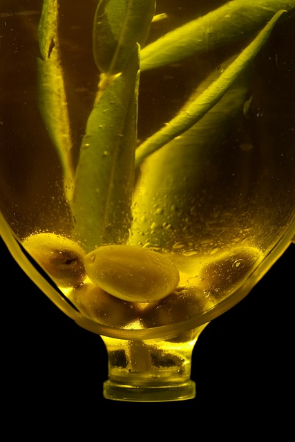 olives and olive oil in a bottle.