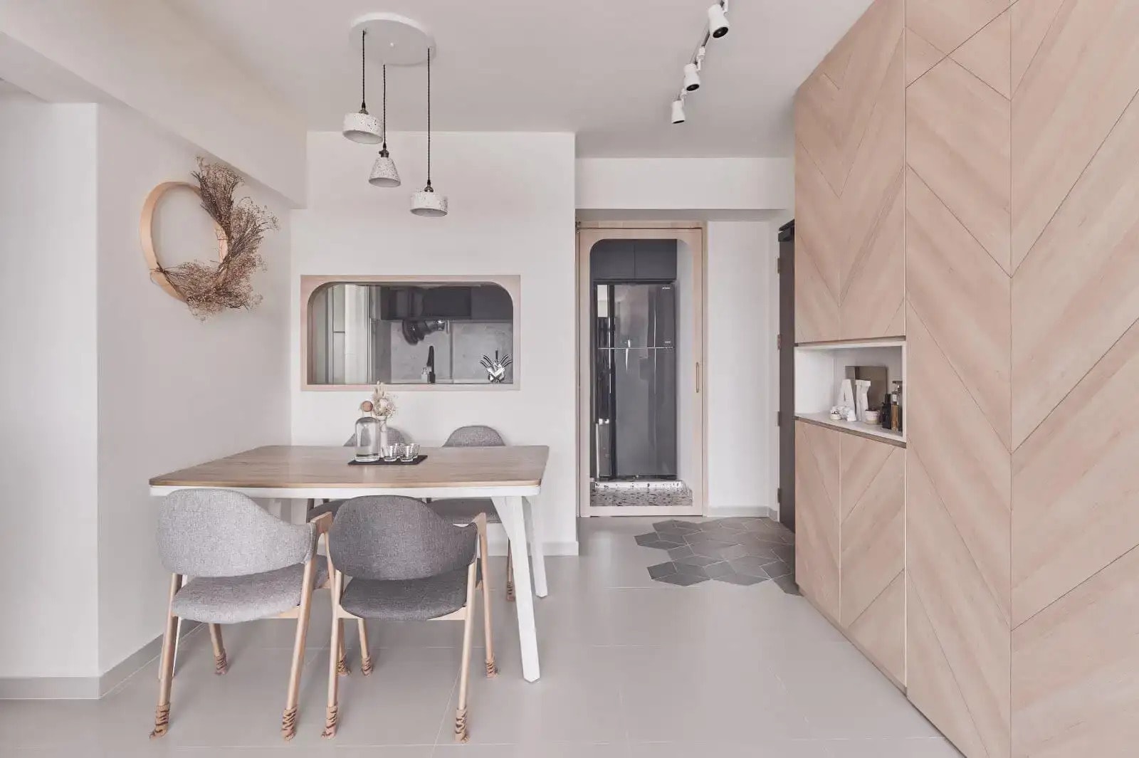 scandinavian house dining with herringbone wood and concealed storage space