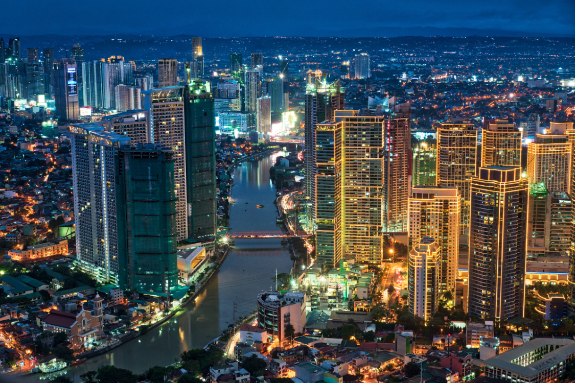 Manila city skyline at night with tall buildings and lights