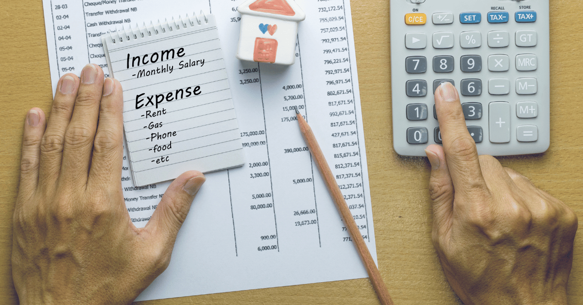 Image showing someone calculating their income and monthly expenses 