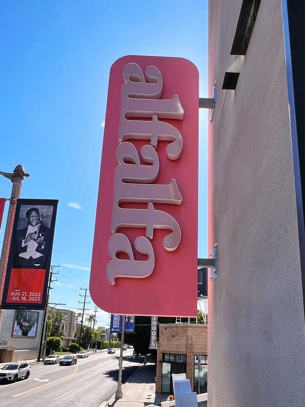 Up close view of the channel letter blade sign for Alfalfa.