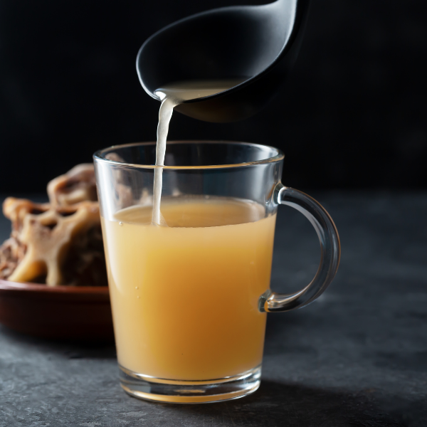 An image showing one cup of beef bone broth promoting healthy sleep durng a fasting window.