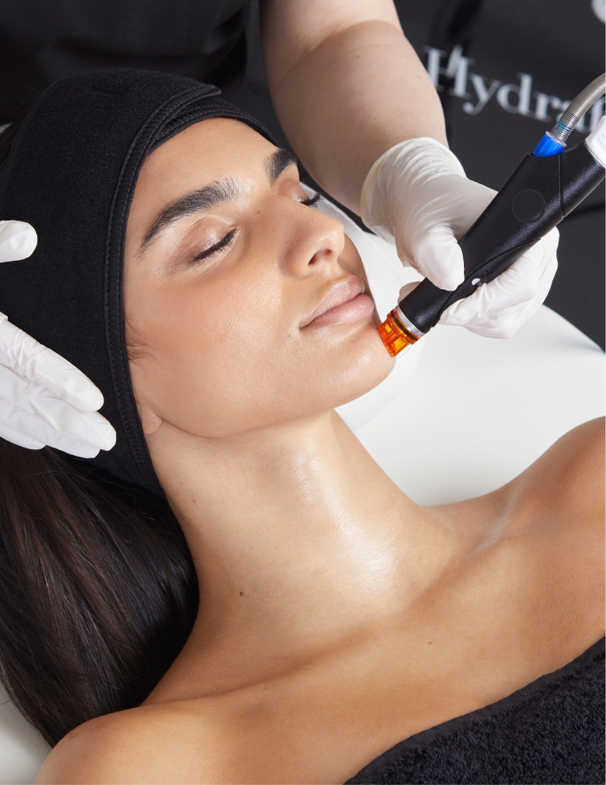 A person receiving a Hydrafacial treatment, one of the most popular skincare procedures among beauty enthusiasts, known as hydrafacials