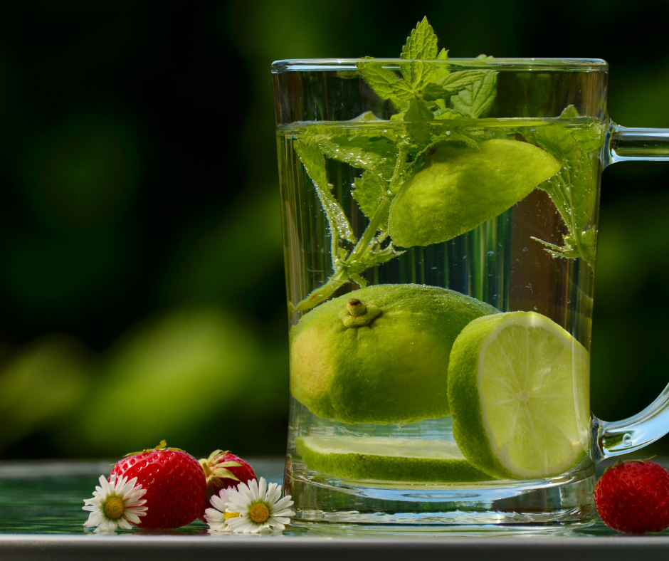 A refreshing image of a glass filled with sparkling water, lime, and mint leaves, a perfect alternative beverage for quitting alcohol and what to drink to stop drinking alcohol