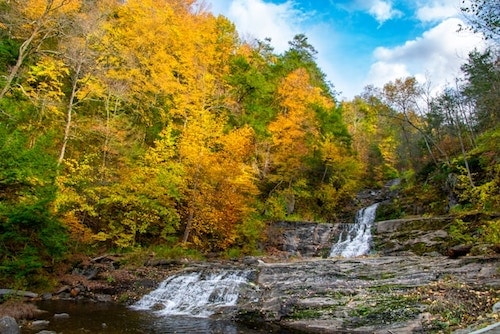 Kent Falls State Park, which feeds into the Housatonic River just beyond its borders. A popular trail ascends along the waterfall