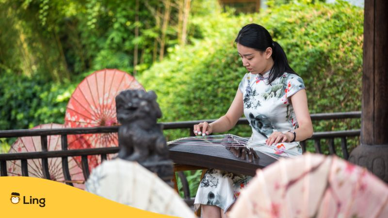 Woman Playing Guzheng Traditional Chinese Music Instrument