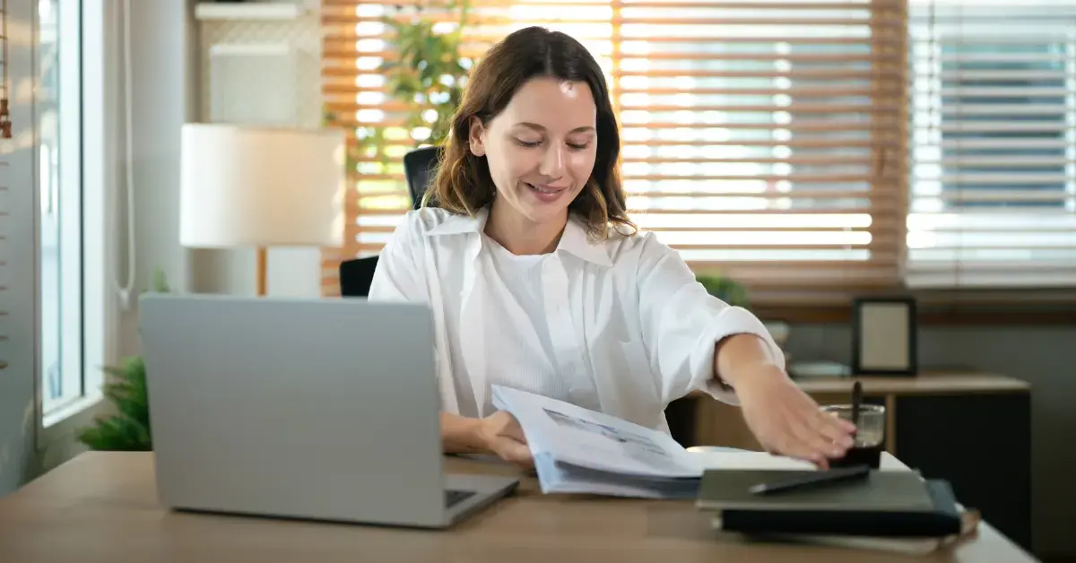Content creator organizing financial documents and tax paperwork while searching when are K-1s due.